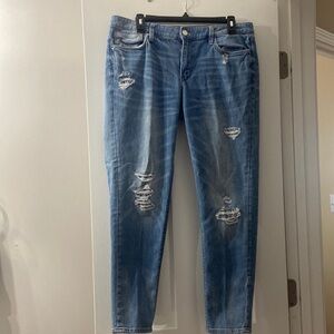 ripped jeans with lace detailing by White House Black Market in size 12